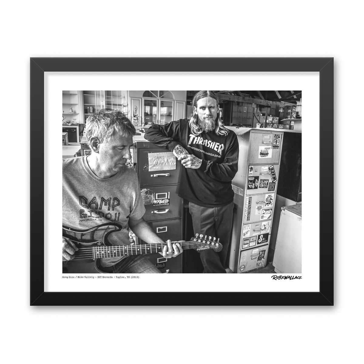 Photo by Rob Wallace: Greg Ginn of Black Flag and Mike Vallely at the SST Records warehouse in Taylor, TX in 2013.