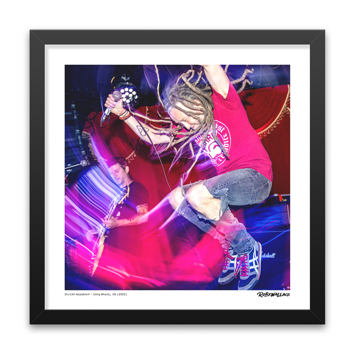 Photo by Rob Wallace: Thomas Barnett of Strike Anywhere airborne live on stage at Alex's Bar in Long Beach, CA in 2022.